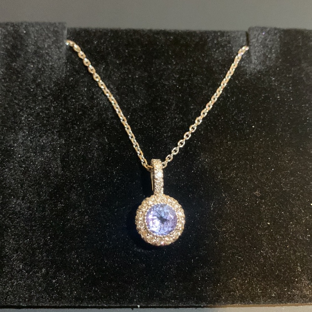 14k white gold tanzanite and diamond halo style pendant with 20 diamonds